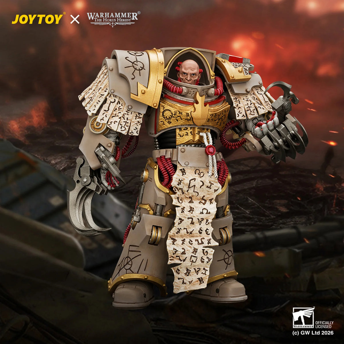 A detailed collectible figure of a Warhammer 40k Space Marine in ornate white and gold armor, holding a scroll with runic symbols, set against a dramatic fiery battlefield background. Brand logos for JOYTOY and Warhammer 40k are visible.