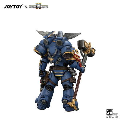 Blue armored figurine with weapon, JOYTOY branding visible