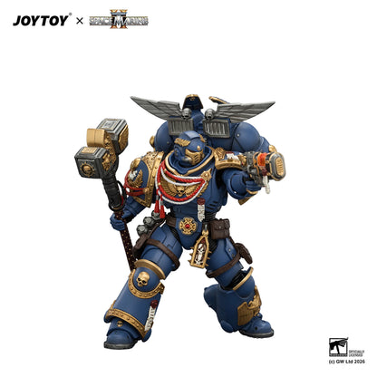 Toy figure of a warrior in blue armor with a hammer, branded as JOYTOY x Games Workshop, on a white background.