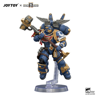 Toy figure of a warrior in blue and gold armor with a weapon, branded with JOYTOY and Games Workshop logos.
