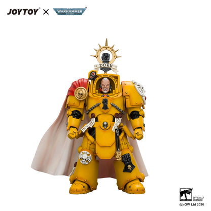 A Joystoy x Warhammer 40k 'Born to Kill' Space Marine action figure on a clean white background. The figure is primarily yellow with a white cape, gold helmet details, and a red shoulder accent, with a small portrait of a man inside the helmet.