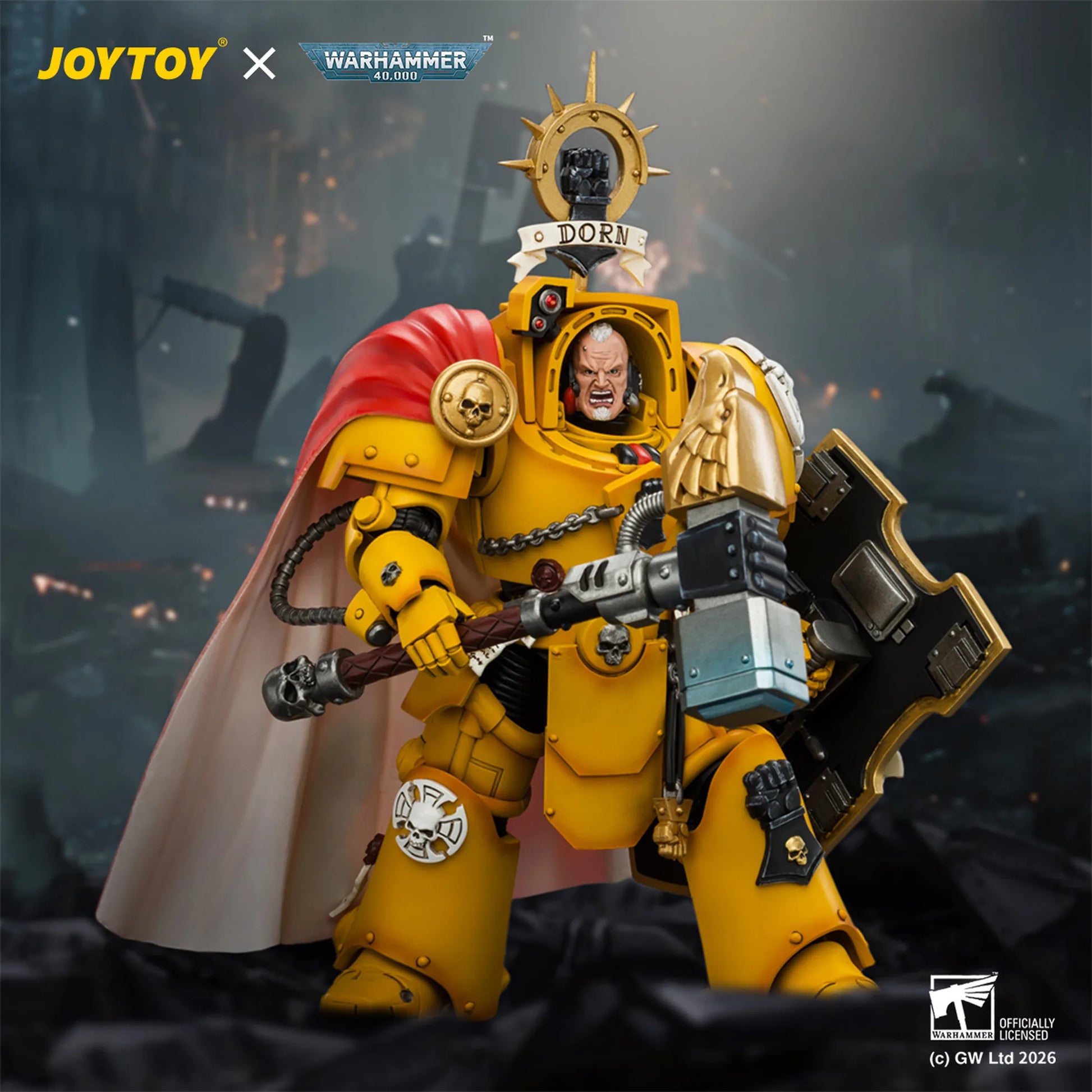 A detailed JoystoY x Warhammer 40k 'Port District' Space Marine figure, featuring a yellow armor plate, red cape, and a skull helmet on its helmet, posed in a dark, smoky battlefield setting.