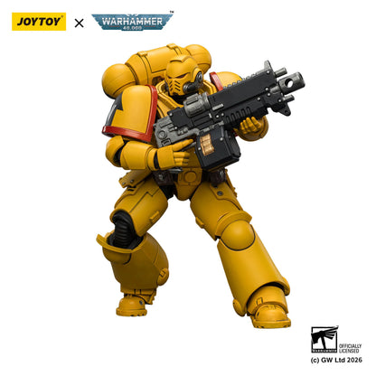Toy figure in yellow armor with a weapon, branded with Joytoy and Warhammer, on a white background.