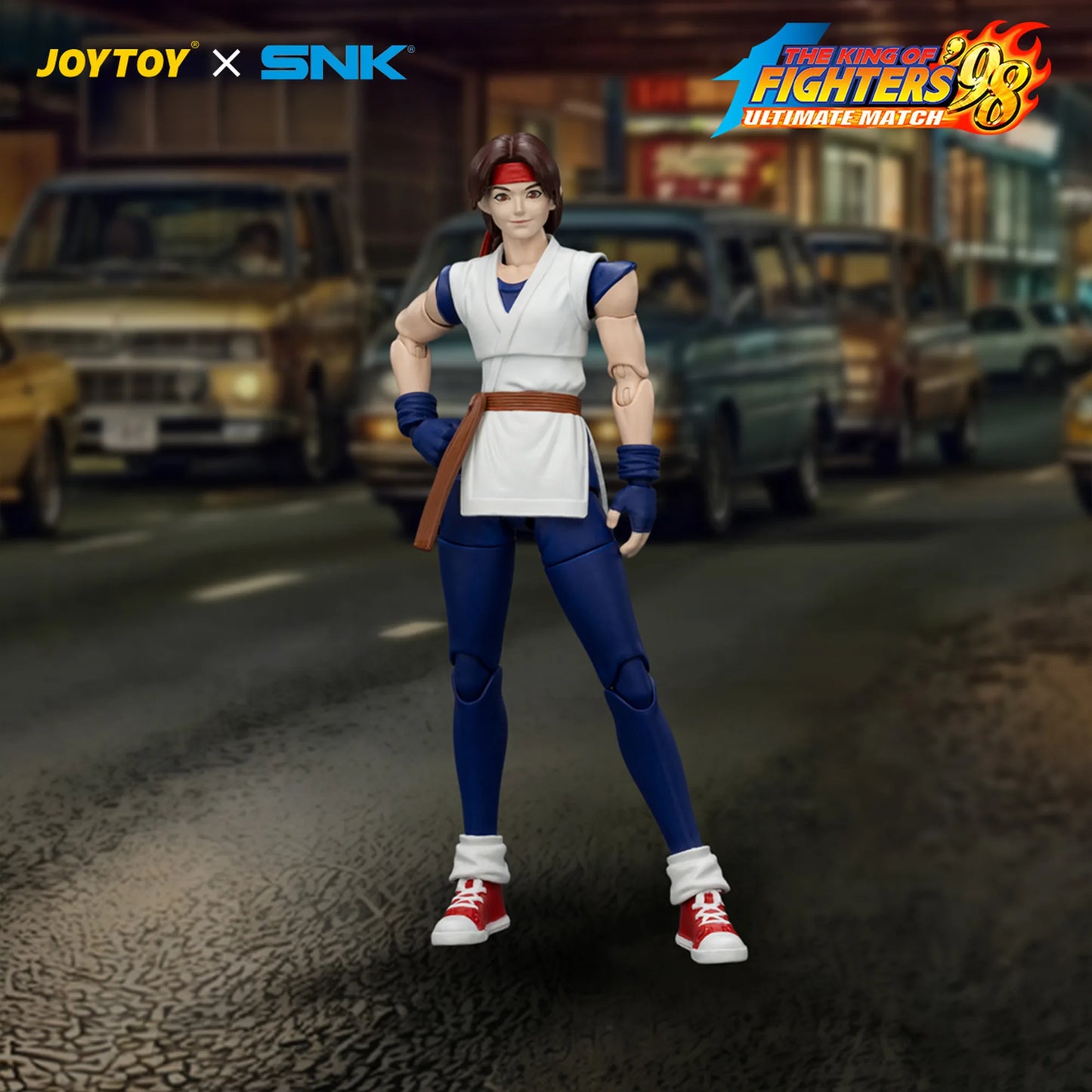 Action figure from 'The King of Fighters' series on a street background with JOYTOY and SNK branding.