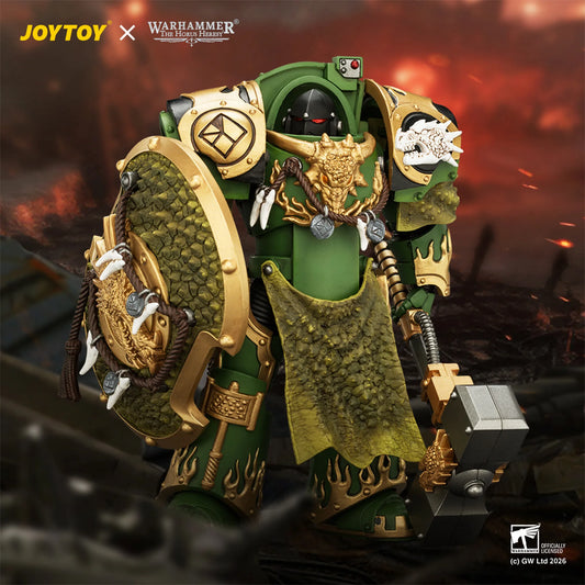 Warhammer 40k JOYTOY x Good Smile Company LGS 1/6 scale collectible figure of a green Space Marine with gold armor, a large shield, and a banner, set against a fiery red and black battlefield background.