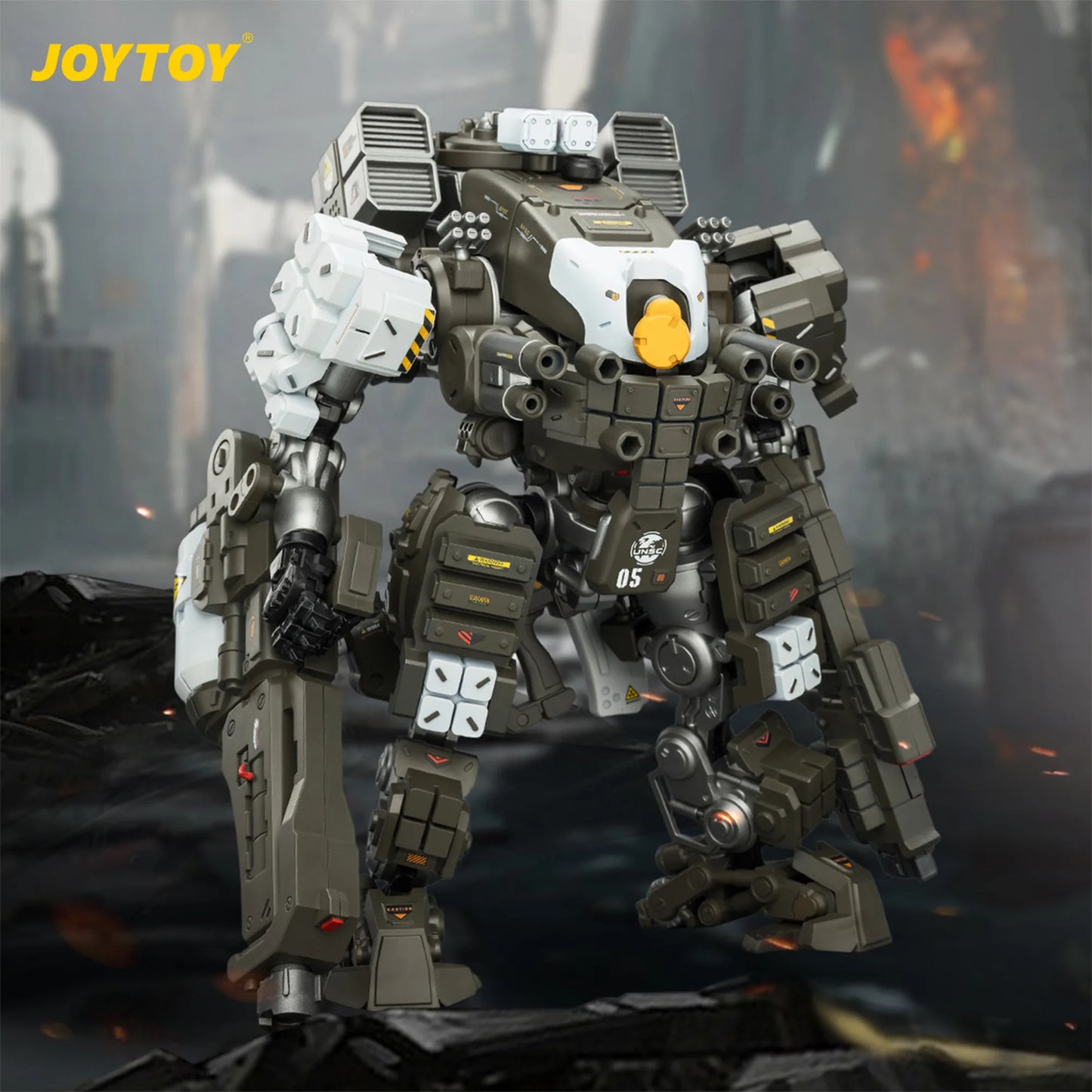 Toy robot model with detailed design on a dark background, featuring the brand 'JOYTOY'.