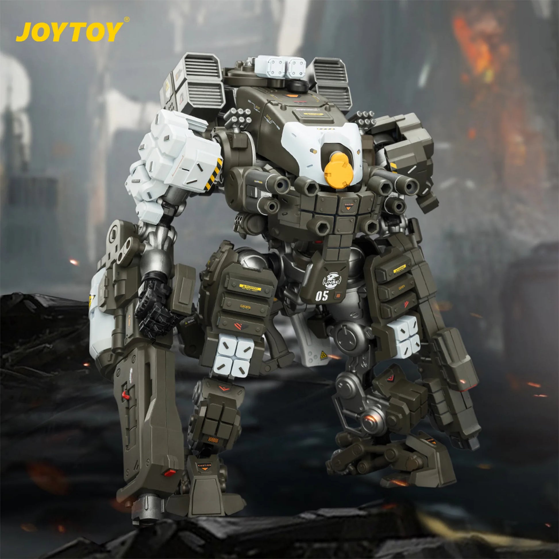 Toy robot model with detailed design on a dark background, featuring the brand 'JOYTOY'.