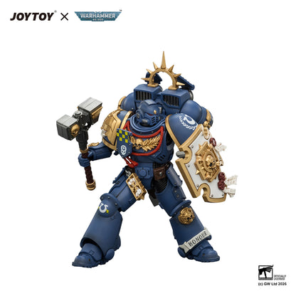 Toy figure with detailed armor and weapons on a white background, featuring JOYTOY and Warhammer branding.
