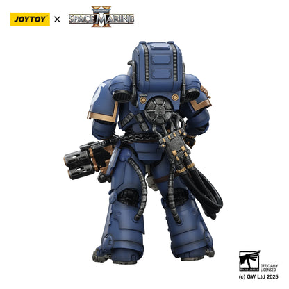 Toy figure of a space marine in blue armor with Joytoy and Games Workshop branding.