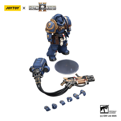 Toy figure of a Space Marine with accessories on a white background, featuring Joytoy and Games Workshop logos.