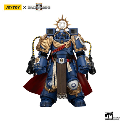 Toy figure of a Space Marine in blue and gold armor with Joytoy branding.