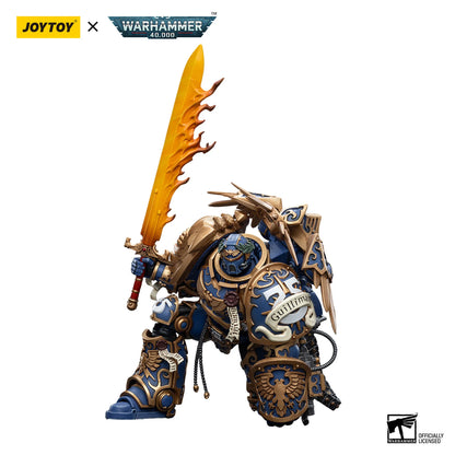 Warhammer 40,000 figurine with a sword, branded by JoyToy and Warhammer, on a white background.
