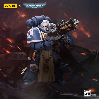 JOYTOY x Warhammer 40k Special Edition Space Marine 6-inch collectible figure, featuring a blue-armored warrior with a white helmet and a tan cloak, holding a rifle, set against a dark, fiery battlefield background.